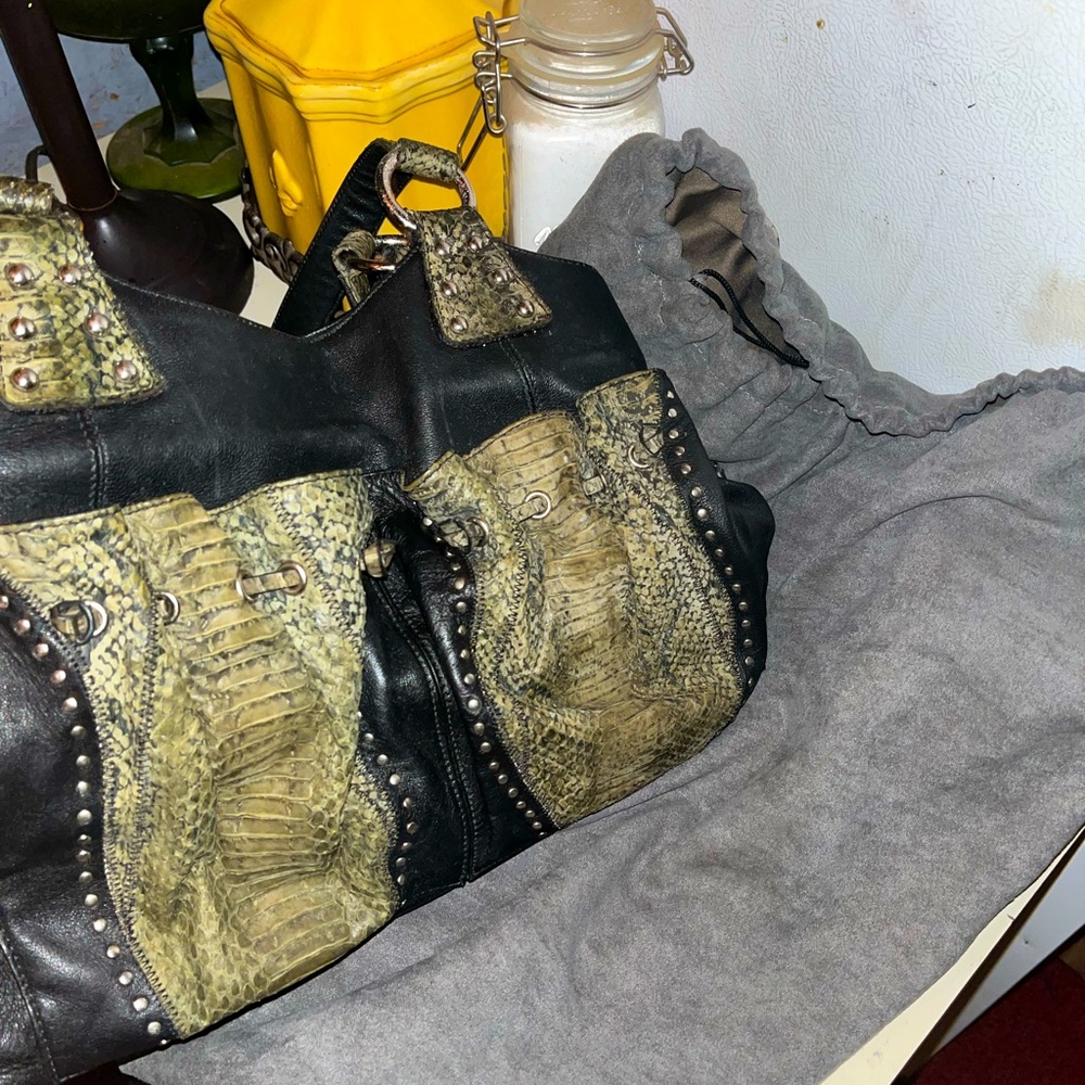 CHI by Falchi Black Lambskin leather and snakeskin.